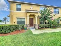 Two story house with landscaping and a double door entrance at 519 Sandstone St, Lakeland, FL 33809