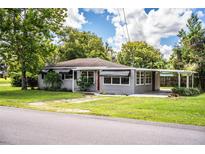 A charming ranch-style home with a gray exterior and well-maintained lawn at 526 3Rd Ne St, Fort Meade, FL 33841