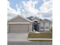 Charming two-story home with a two-car garage at 4722 Harts Brook Ln, Mulberry, FL 33860