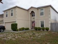 Two-story house with attached garage at 600 Sunway Ln, Winter Haven, FL 33880