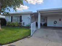 Single story home with carport and well-maintained lawn at 462 Cameo Dr # 462, Lakeland, FL 33803
