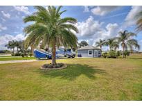 Charming guest house with a paved patio and RV parking at 544 Narrow Pond Rd, Polk City, FL 33868