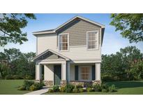 Two-story house with gray and beige siding, green door, and stone accents at 265 Crossings Ave, St Cloud, FL 34771