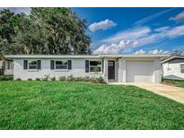 Charming ranch home with white brick exterior and landscaped lawn at 2350 E Washington St, Bartow, FL 33830