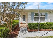House exterior showcasing walkway, landscaping, and entrance at 1618 Birchwood Loop, Lakeland, FL 33811