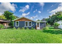 Newly renovated home with dark siding and wood accents at 315 Keat Ave, Auburndale, FL 33823