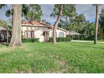 Charming house with lush landscaping and a carport at 1806 17Th Nw St, Winter Haven, FL 33881