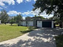 Mid-century modern home with a large front yard at 2128 Sycamore Dr, Winter Park, FL 32789