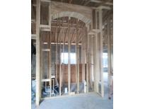 Unfinished kitchen framing with arched entryway at 7391 Orlando Dr, Lake Wales, FL 33855