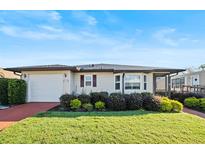 Charming single story home with well-manicured lawn at 4904 Goldenview Ln, Lakeland, FL 33811