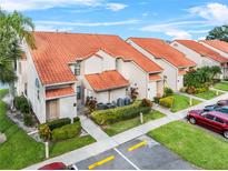 Aerial view of condo community with lake access at 1710 Garden Lake Dr # 1710, Winter Haven, FL 33884