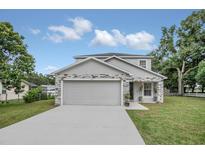 Two-story house with gray siding and stone accents at 258 Padgett Pl S, Lakeland, FL 33809