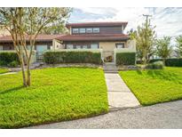 Attractive home exterior with manicured lawn and walkway at 1 Loma Linda, Lakeland, FL 33813