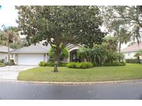 Charming one-story house with a well-maintained lawn and landscaping at 108 Lake Region N Blvd, Winter Haven, FL 33881