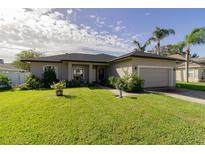 One-story home with a two-car garage and well-maintained lawn at 346 Sterling Dr, Winter Haven, FL 33884