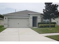 One-story house with attached garage and landscaped front yard at 3136 Country Club Cir, Winter Haven, FL 33881