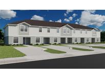Three-unit townhome building, light-grey siding, two parking spaces per unit at 309 Wharf Way, Winter Haven, FL 33881