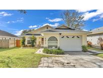 Charming single-story home with attached garage and landscaped front yard at 4617 S Devon Ave, Lakeland, FL 33813