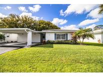 Charming single-story home with attached carport and lush green lawn at 540 Kelsey St, Lakeland, FL 33803