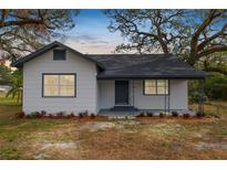 Charming renovated home with a newly painted exterior and landscaping at 4925 Magnolia Ave, Mulberry, FL 33860