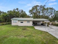 Ranch-style house with carport and fenced yard at 210 Wilder Rd, Lakeland, FL 33809