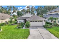 One-story home with landscaped yard, attached garage, and attractive curb appeal at 6650 Lake Clark Dr, Lakeland, FL 33813