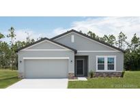 Beautiful two-story home with a two-car garage and stone accents at 3527 Fernanda Dr, Deltona, FL 32738