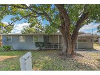 Charming ranch home with mature tree and screened porch at 1355 Powers Ave, Daytona Beach, FL 32117