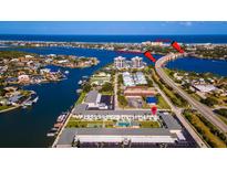 Aerial view showing location near waterway and bridge at 335 N Causeway # C220, New Smyrna Beach, FL 32169