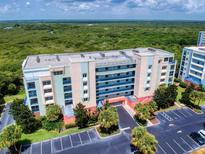 Multi-story condominium building with parking and waterfront views at 5300 S Atlantic Ave # 9201, New Smyrna Beach, FL 32169