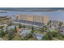 Aerial view of Admiralty Club condos, waterfront property, and surrounding area at 3606 S Peninsula Dr # 208, Port Orange, FL 32127