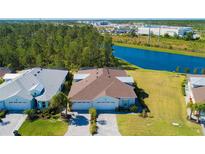 Two-story homes with attached garages and waterfront views at 933 Attitude Ave, Daytona Beach, FL 32124