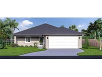 One-story home with a two-car garage and attractive landscaping at 128 Indian Creek Rd, Oak Hill, FL 32759
