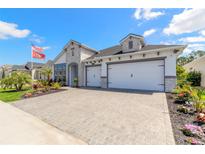 Two story home with stone accents and three car garage at 552 Mosaic Blvd, Daytona Beach, FL 32124