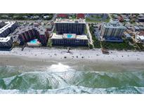 Aerial view of beachfront property with ocean and pool at 4139 S Atlantic Ave # B204, New Smyrna Beach, FL 32169