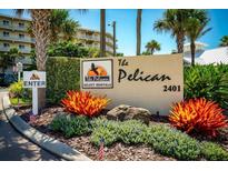 The Pelican Select Rentals building signage, welcoming guests to the property at 2401 S Atlantic Ave # D304, New Smyrna Beach, FL 32169