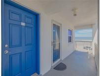 Blue door to condo with ocean view from balcony at 1111 Hill St # U3, New Smyrna Beach, FL 32169