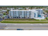 Multi-story building with pool and ample parking at 3700 S Atlantic Ave # 402, New Smyrna Beach, FL 32169