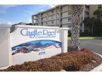 Castle Reef Condominium sign, featuring the address 4175 at 4175 S Atlantic Ave # 4120, New Smyrna Beach, FL 32169