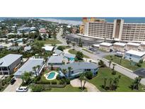 Elevated view of a house with a pool near the beach at 320 Due East St, New Smyrna Beach, FL 32169