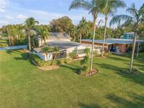 Aerial view of mid-century modern home with large yard at 501 S Peninsula Ave, New Smyrna Beach, FL 32169