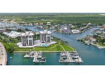 Aerial perspective of waterfront property with boat slips at 501 N Causeway # 2050, New Smyrna Beach, FL 32169