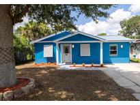 Newly renovated blue home with white accents and landscaping at 2616 Belmont Ave, New Smyrna Beach, FL 32168