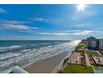 Aerial view of beachfront property, highlighting its oceanfront location and community amenities at 4153 S Atlantic Ave # 5010, New Smyrna Beach, FL 32169