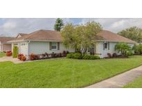 Single-story home with attached garage and well-manicured lawn at 682 Middlebury Loop, New Smyrna Beach, FL 32168