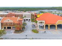 Aerial view of commercial building, parking lot and surrounding area at 1653 N Us Highway 1 # 201, Ormond Beach, FL 32174