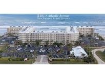 Aerial view of beachfront condo with parking and ocean views in New Smyrna Beach at 2401 S Atlantic Ave # C206, New Smyrna Beach, FL 32169