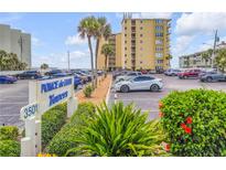 Ponce de Leon Towers building exterior and parking lot at 3501 S Atlantic Ave # 407, New Smyrna Beach, FL 32169
