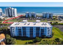 Oceanfront property with condo building and parking area, near beach access at 5300 S Atlantic Ave # 17-506, New Smyrna Beach, FL 32169