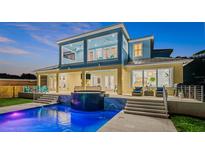 Relaxing pool and spa with a cascading water feature at 73 Cunningham Dr, New Smyrna Beach, FL 32168